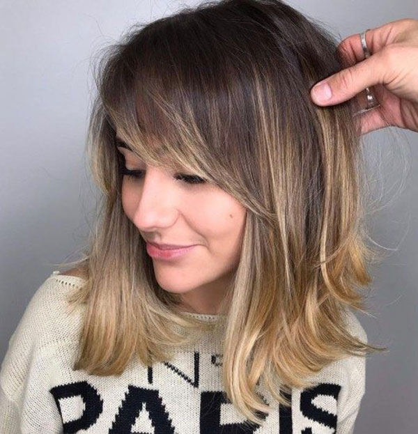 Medium Hairstyle with Bangs for Women